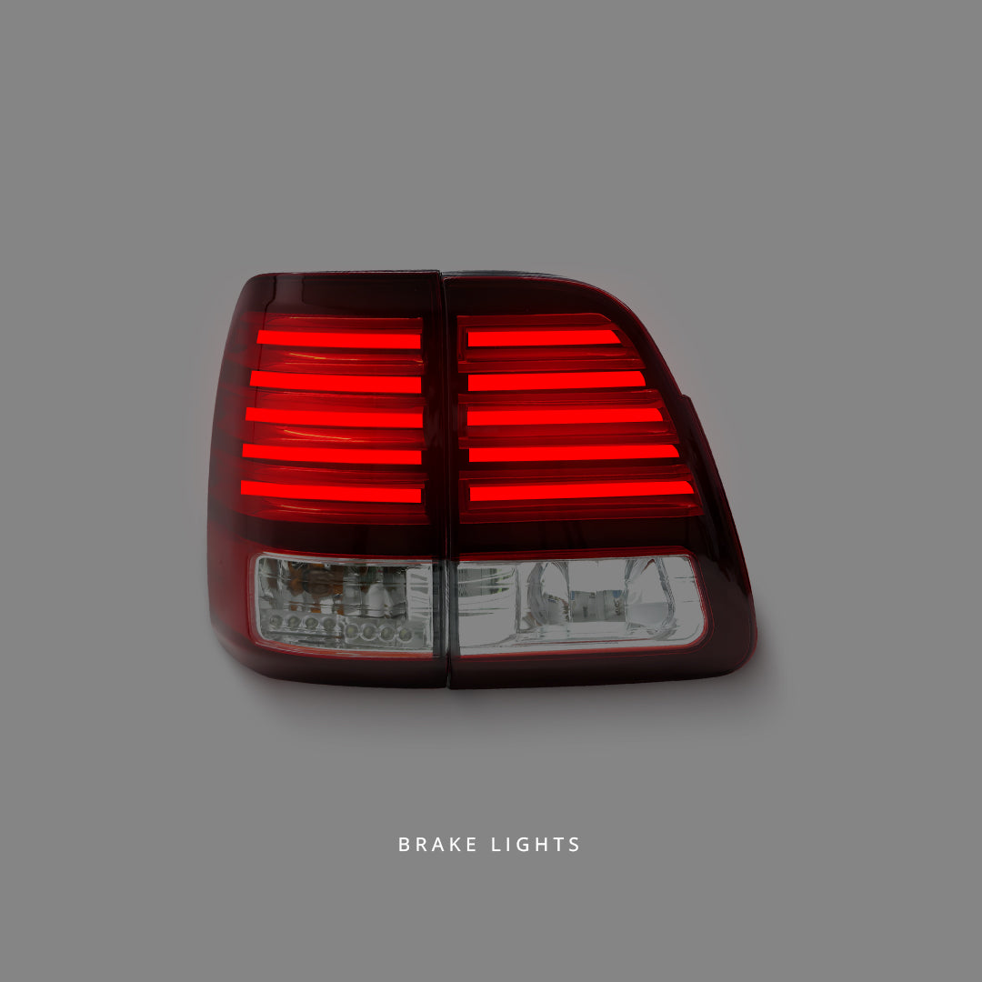 Toyota LandCruiser 100 Series (1998 - 2007) Clear Red LED Tail Lights LH + RH